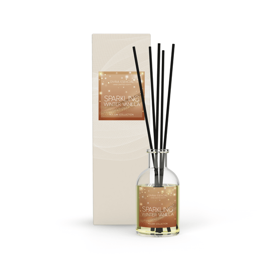 A clear glass reed diffuser with five fiber stick reeds and two sola flowers, presented in an elegant, branded box with 'Sparkling Vanilla' written on it.