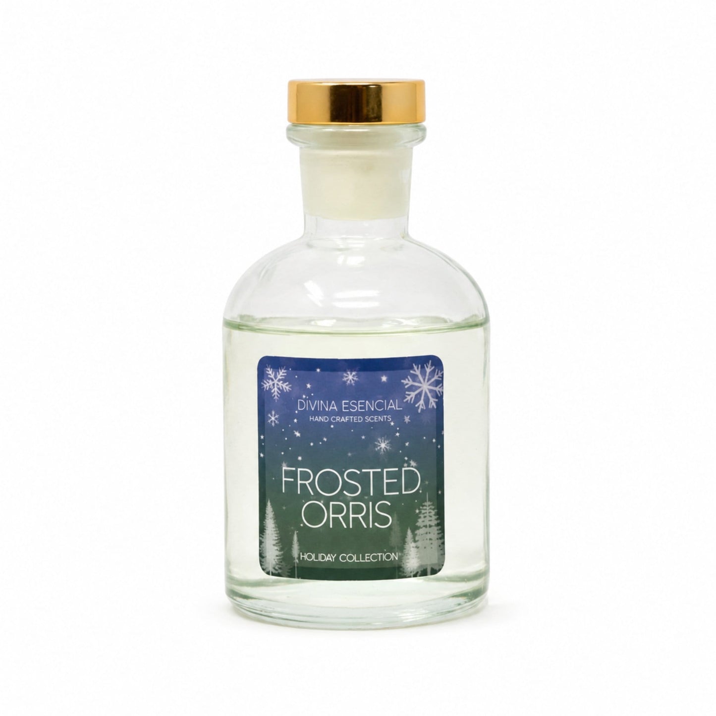 A clear glass bottle of Livna Essential handcrafted scents 'Frosted Orris' with a gold cap and a blue winter-themed label, set against a plain white background.